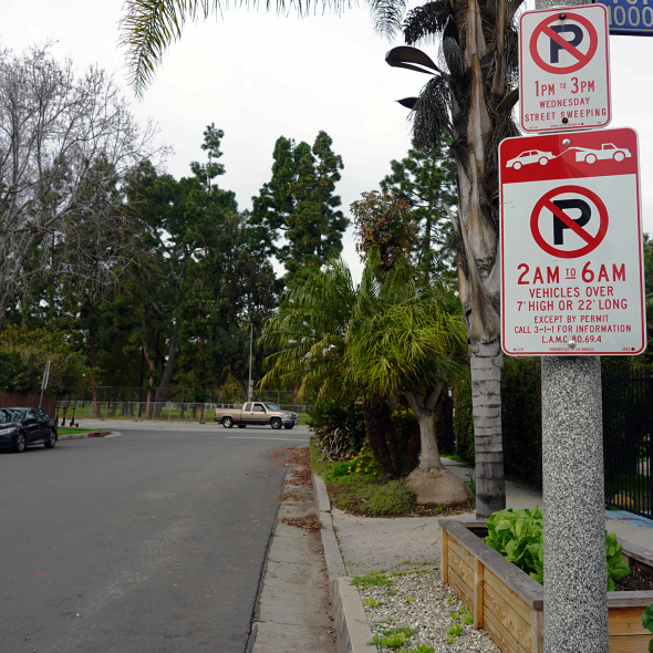 Parking signs banning parking overnight for oversized vehicles.